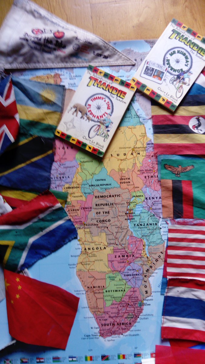 beyondthebike's tweet photo. Getting ready for @kidslitfest with @EconomicCyclist @TimHole Books, map of Africa, flags from the countries we cycled through. Supporting @GameRangersInt @BOZambia we'll be there all day, speaking at 3.30 in the bookshop marquee. #thandiethetandem #weareallrangers #beyondthebike https://t.co/0LgEzDLXuV