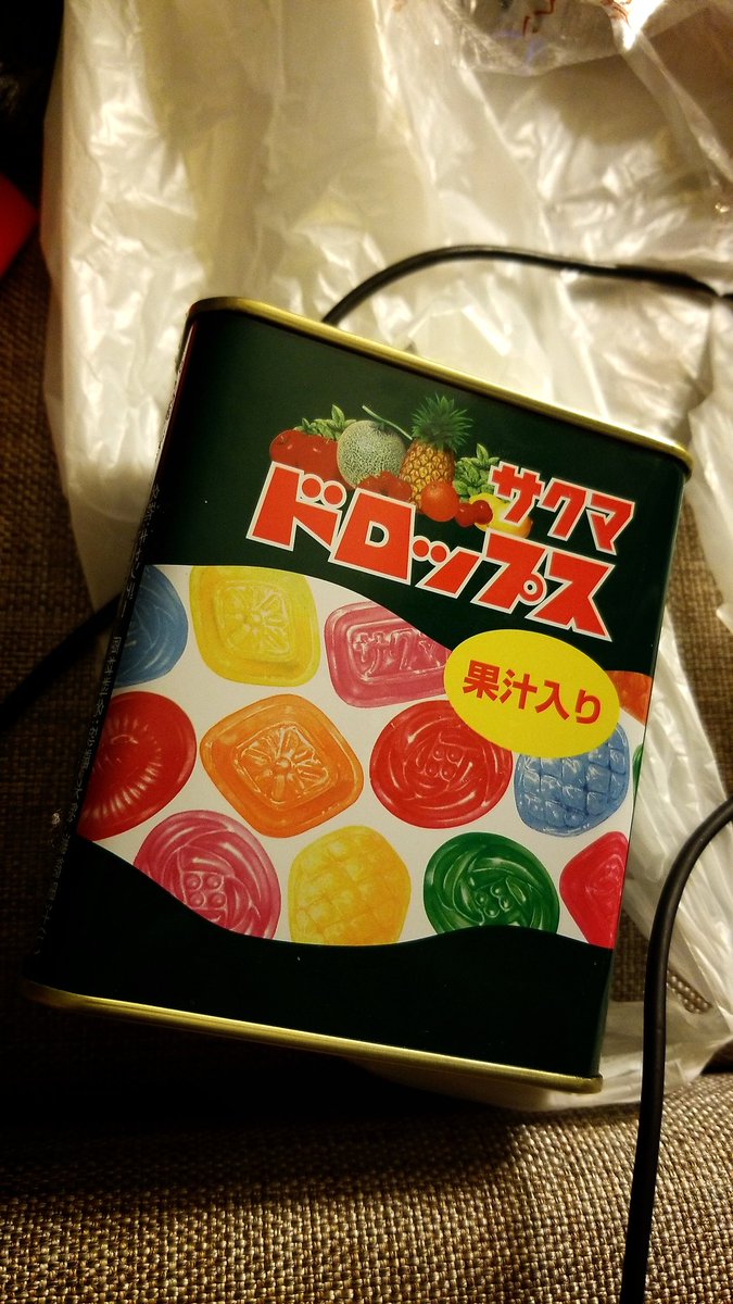 He's having some candy as he grades a few projects.