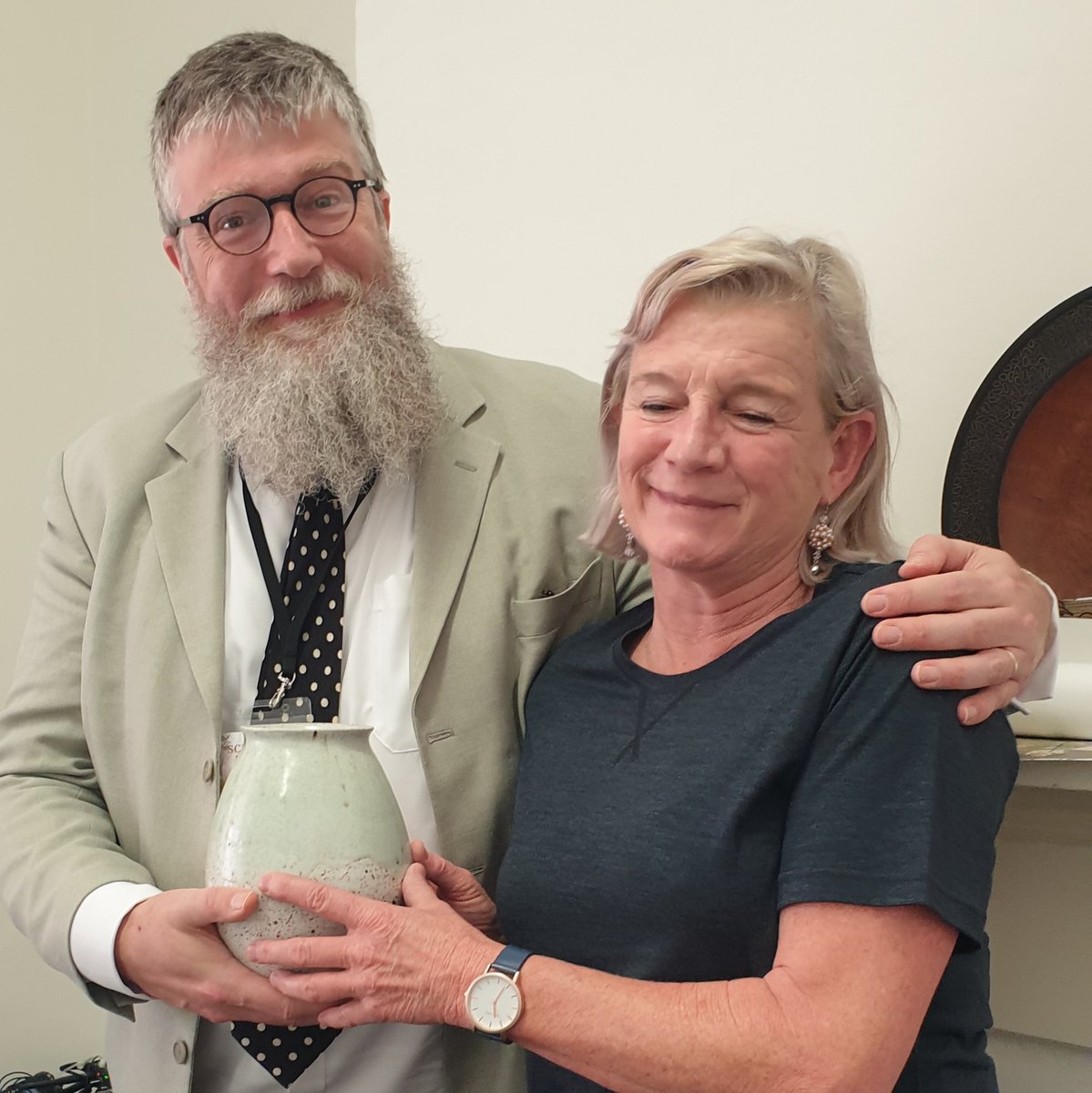 PhilipArdagh's tweet photo. Honoured to be presenting Australian national treasure, children's author & illustrator, @alisonlestersh this beautiful pot I just stole off the mantlepiece in the @scribblersfest green room... but she doesn't know that. #SoGiving #NotAboutMe @AllenAndUnwin https://t.co/FXmFGavylE
