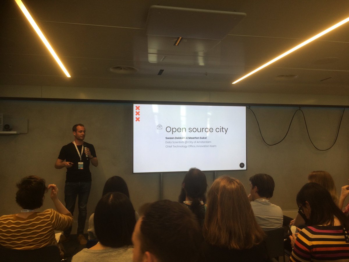 Talking open source city with Maarten Sukel and Swaan Dekkers from the city of Amsterdam from a room with a view over city hall at #PyDataAmsterdam