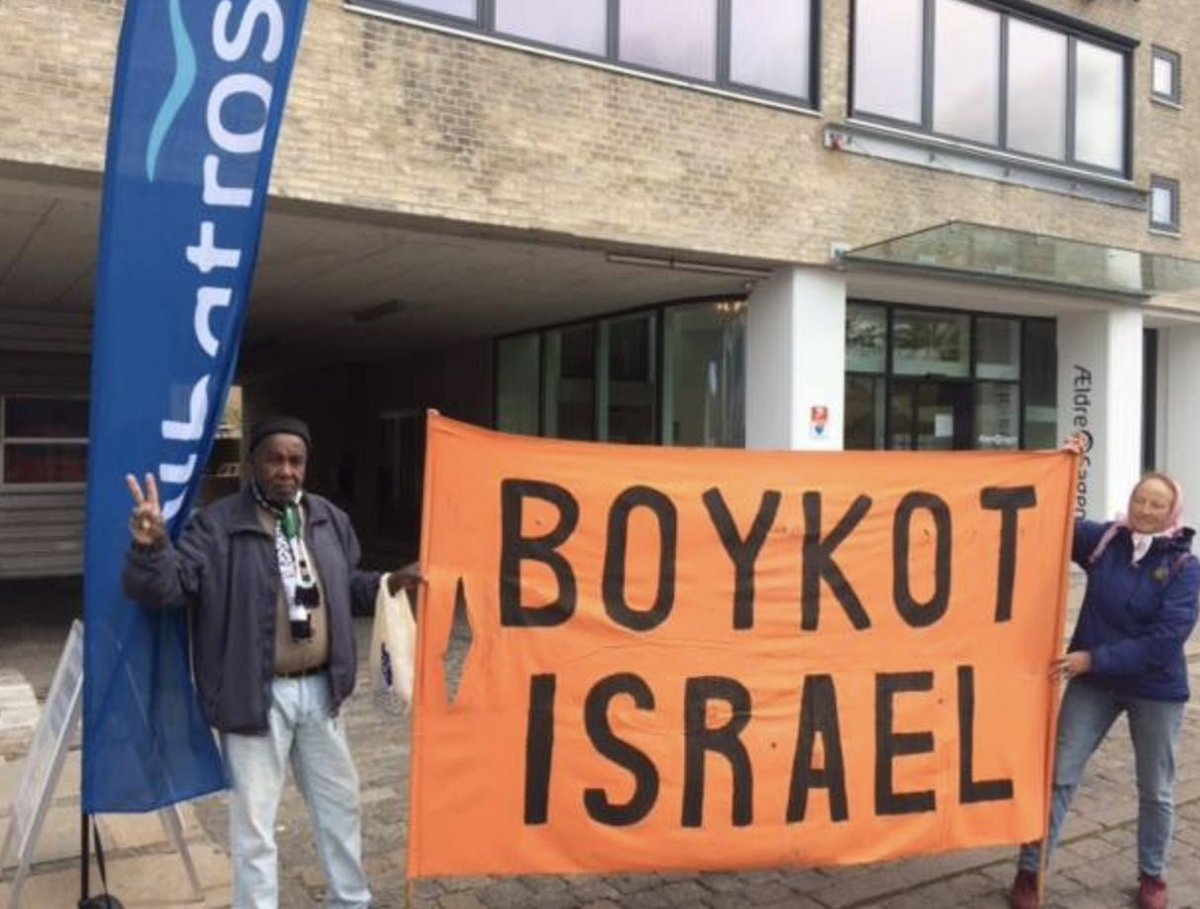 BDSmovement's tweet photo. Boykot Israel-DK protested Albatros Travel’s tourism fair in Copenhagen. 

Albatros promotes tourism to Israel, including “Judea &amp; Samaria,” with no mention of Israel’s West Bank occupation. 

Abatros whitewashes Israel’s crimes against Palestinians. https://t.co/1x6TSuL8Yt https://t.co/jR0mLpOvNc