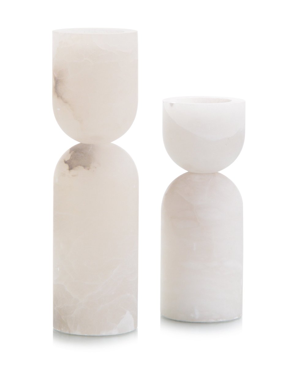The sculptural nature of these Alabaster Candleholders make them perfect for the modern home. For more details, click here ow.ly/cUko30oIFlc  #alabasteraccessories #luxedecor #candleholders #johnrichard #design #interiordesign