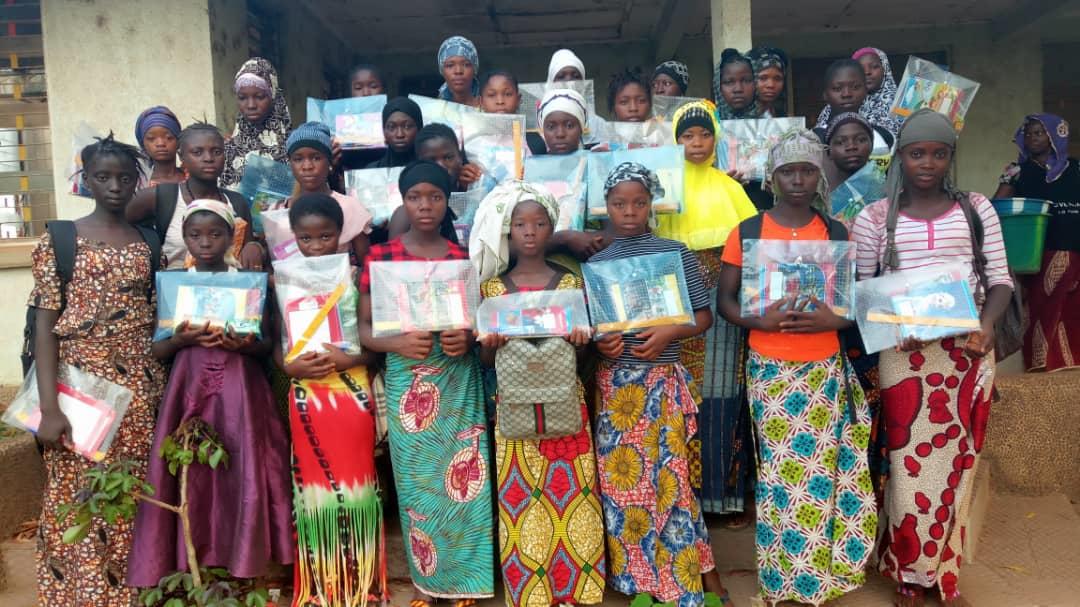 UNFPASierraleon's tweet photo. GATES students (Girl's Access to Education and Services) from the Community Learning Centre Kukuna Village, Kambia District, receive education packs, as part of their accelerated learning and life skills course #GATES #EmpowerGirls #LeaveNoOneBehindSL https://t.co/sb5JE3N2uu