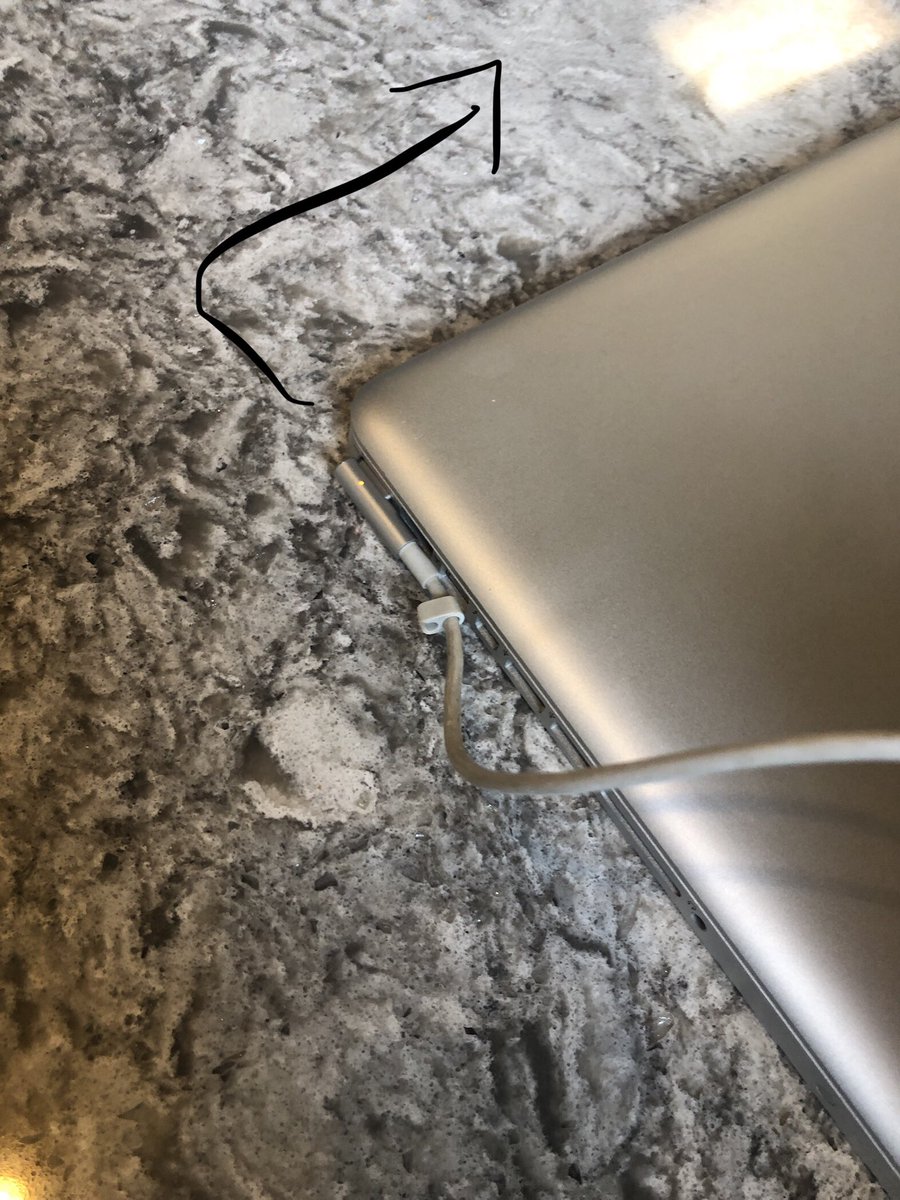 mediakath's tweet photo. @AppleSupport why is this MacPro cord attached upside down? Awkward?! https://t.co/TPzw0lVN2a