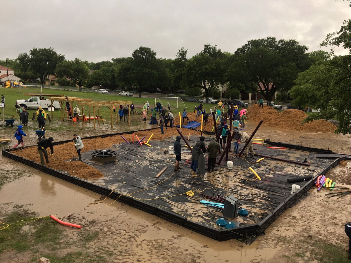 FortWorthISD's tweet photo. Volunteers braved rain and mud to construct a state-of-the-art playground at North Hi Mount Elementary School. The playground, funded by KaBOOM!, replaces a 30-year old play space! https://t.co/f5pi15g0hE https://t.co/izNDhrpKXc
