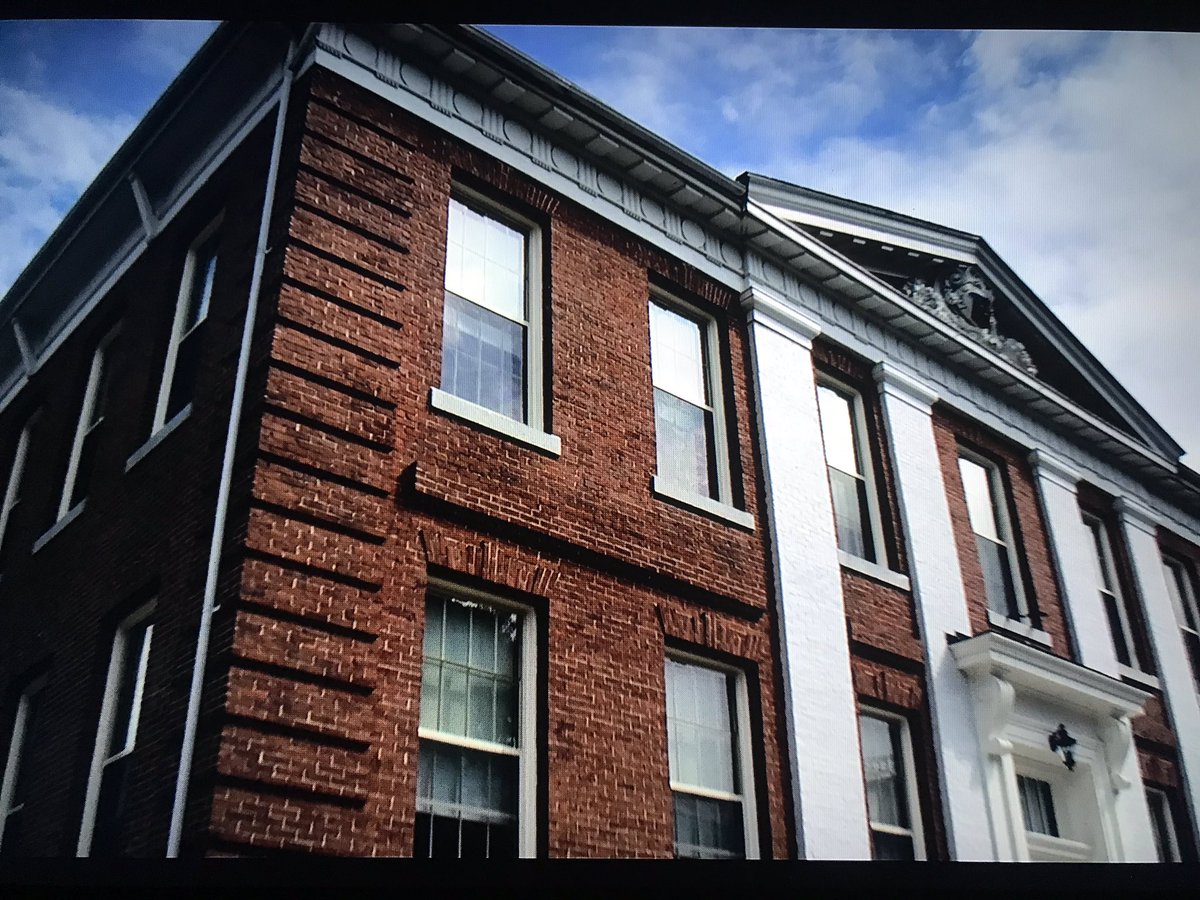 The  @thesociety series begins with a shot of West Ham Town Hall. In reality, the building serves as the Town of Lancaster’s municipal offices. The show shot both interior and exterior scenes in this building. Movie left; Today right