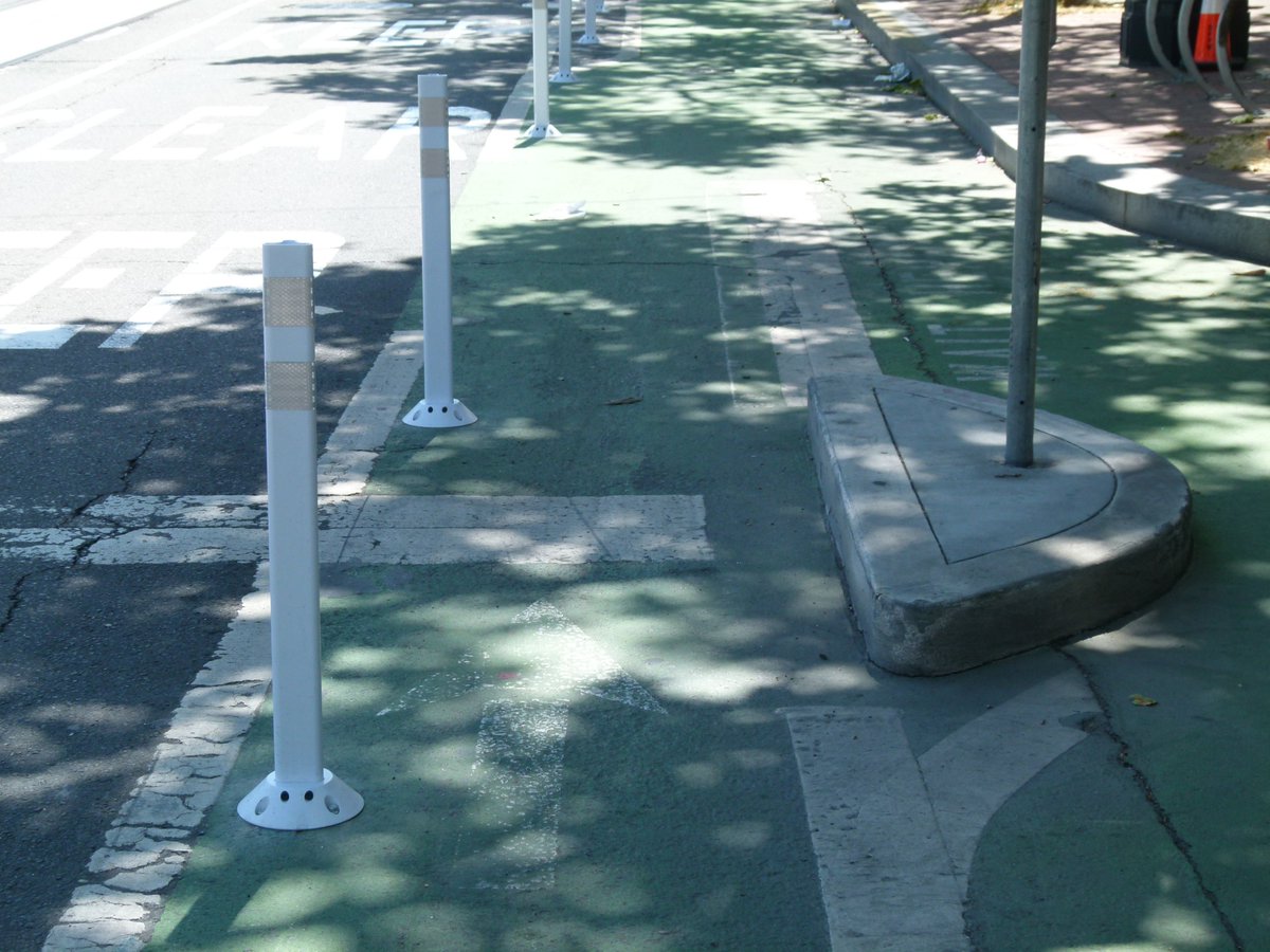At the jughandle itself, the new posts narrow the through-lane to only 2'11"! Yow! That is not ok.A lot of people saw this and fixated on the posts being installed on the green paint. My position is that the paint is irrelevant, the width is what matters.