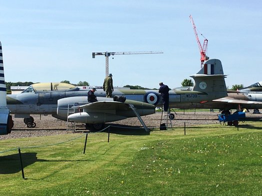 NewarkAirMus's tweet photo. The #NAMrestoration team working on the repaint of #MeteorNF14 #WS739 seem to have enlisted some 'heavy-lift' assistance for their project! #ItsBehindYou was the cry! #NAMdeveloping https://t.co/94tqFCTze5