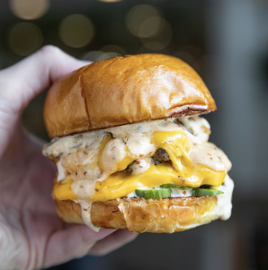 dineLA's tweet photo. Today's #dineLABurgerTrek ๐ is brought to you by @fundamentalla. Their double patty cheeseburger with caramelized onions, American cheese, Thousand Island dressing and pickles has us drooling ๐คค. Get the burger at their #westwood and #dtla locations! #fundamental https://t.co/pXKsLquctM