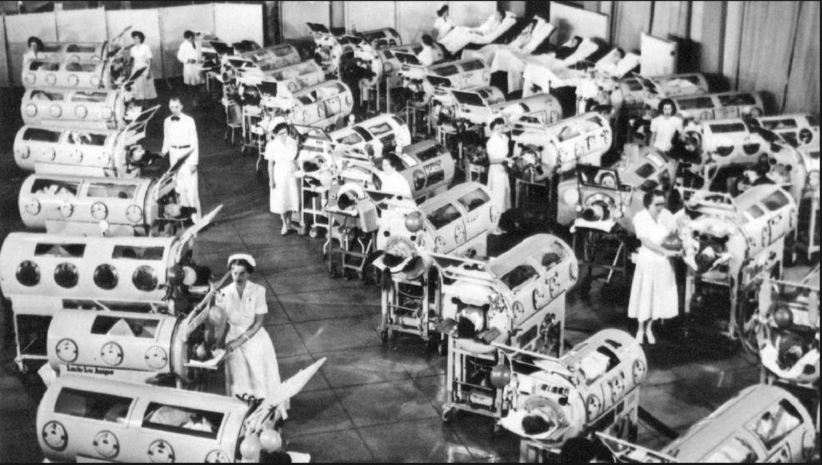 A visual argument for vaccines, in five tweets:1/ A ward of polio victims, incarcerated inside "iron lungs" in 1950s America. Many are children, their lungs paralysed, unable to breathe unaided. Thanks to vaccination, no-one has caught polio in the UK since the 1980s.