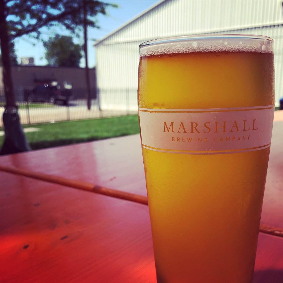 MarshallBrewing's tweet photo. It’s a perfect afternoon for a beer in the Biergarten! Plenty of sun (or shade, if that’s your thing) to pair with a Sundown Wheat! Open 2-9pm, with Drew and Ben behind the bar! https://t.co/j7cK4STASr