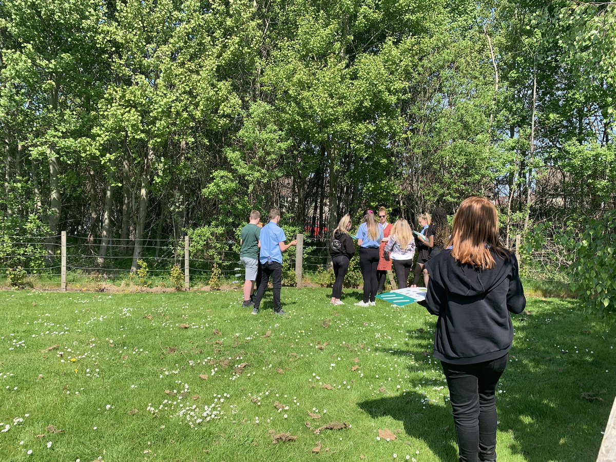2LY and Ms. Scott enjoying the sun and doing some Tree Identification.