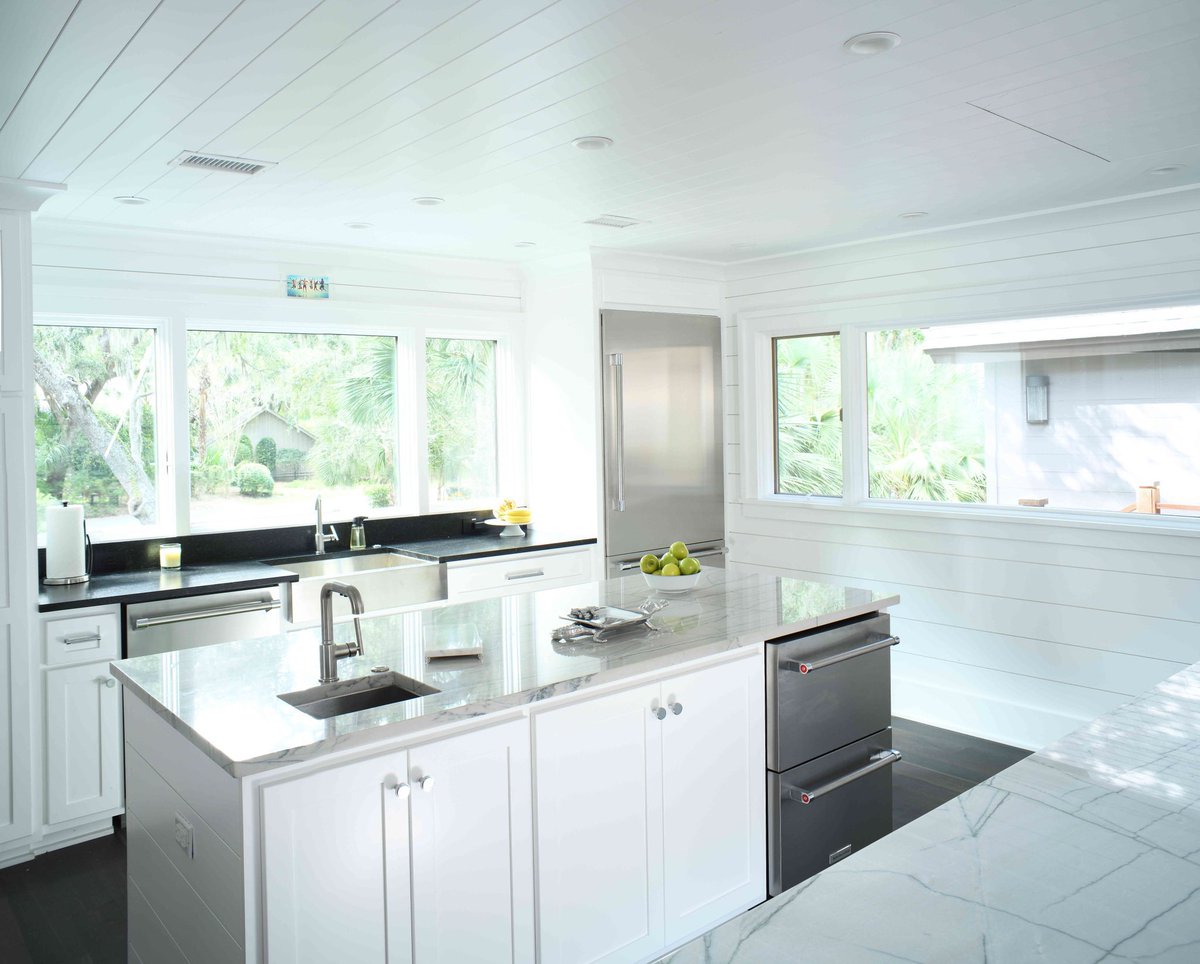 Freshen up your kitchen with white cabinets and dark flooring!