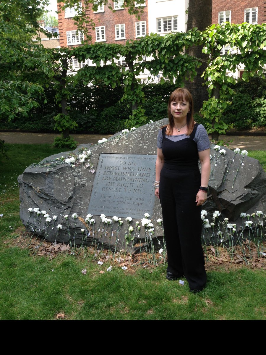 FWWCCC2019's tweet photo. Some photos from International COs Day in Tavistock Sq, London. Including Chloe Mason laying a white flower and CCC's Lois Bibbings post her speech. https://t.co/rtlN6rCSai