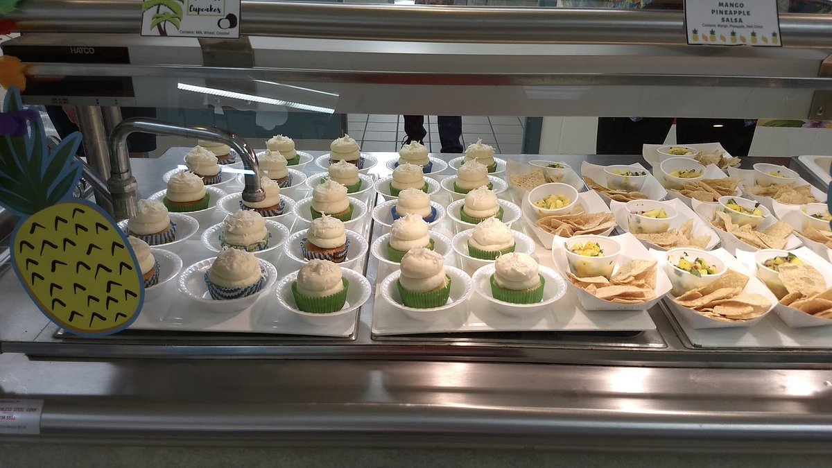 GLPS_rightnow's tweet image. Even lunch is for learning! Alexa Ross -- an MSU intern in the colorful shirt next to GLPS's Carol Jegla -- created a special Hawaiian themed lunch at Hayes: Hawaiian sweet &amp;amp; sour chicken, Hawaiian sticky rice, mango pineapple fruit salsa, tiki time coleslaw, &amp;amp; coconut cupcakes.