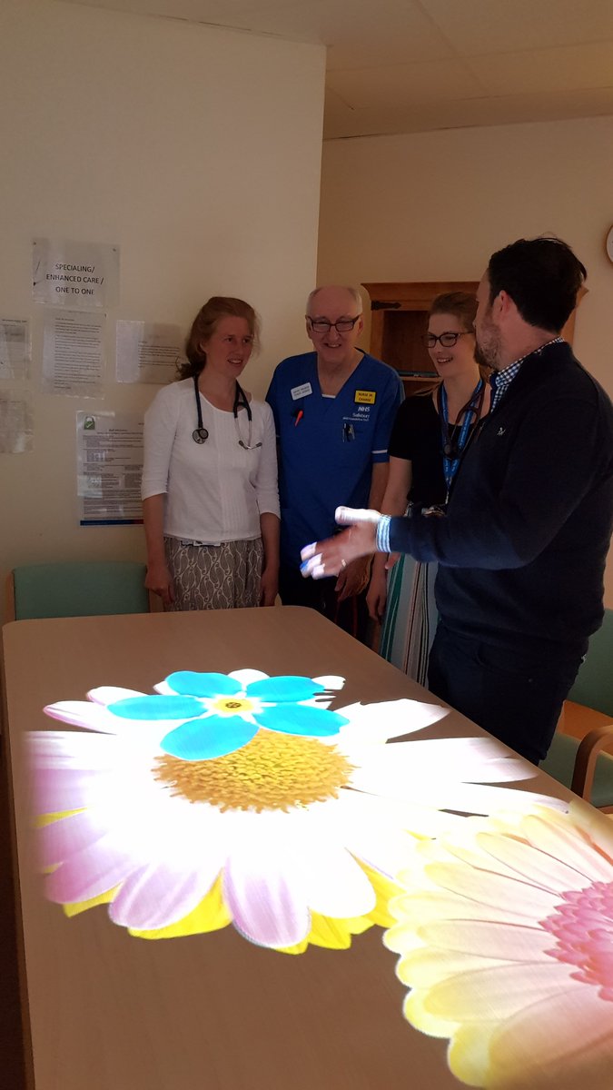 SFTDementiaTeam's tweet photo. Magic Table demonstration Spire Ward. Stimulates cognition, physicality and socialising. Also, improves wellbeing through recognition, fun and reminiscence. Generously funded by The League of Friends. https://t.co/vJINh4rH1g