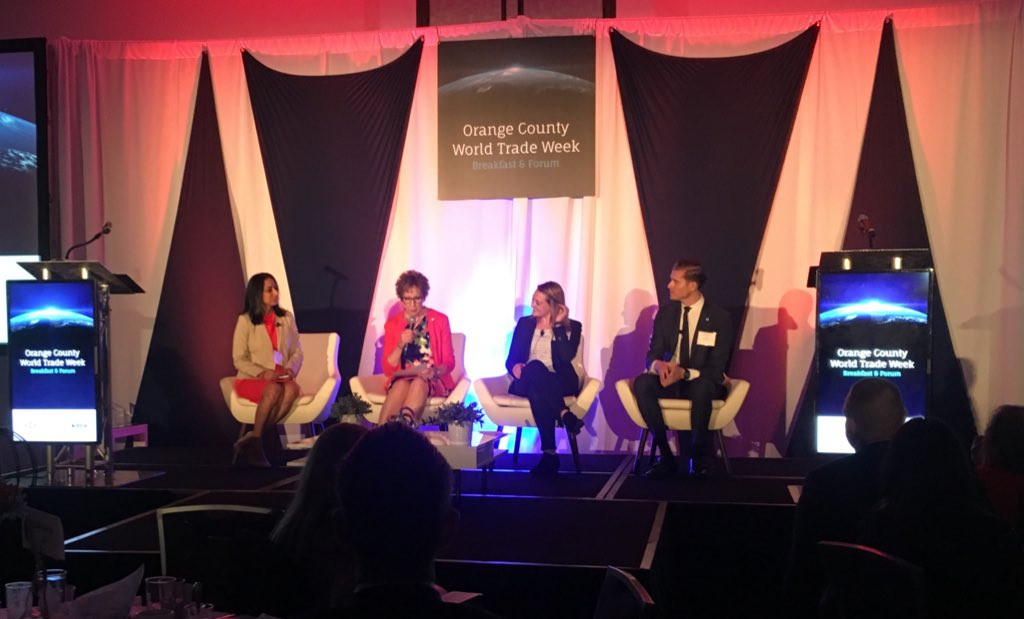 IrvineChamber's tweet photo. Greater Irvine Chamber Executive Vice President Linda DiMario welcomes the 2019 #OCWorldTradeWeek Export Success Panelists to the stage; Jessica Kleinert of @tacobell, Michael Delaney of Worldwide Environmental Products Inc., and Harvinder Mudahar of @Technologent. https://t.co/c59zPl2XOA