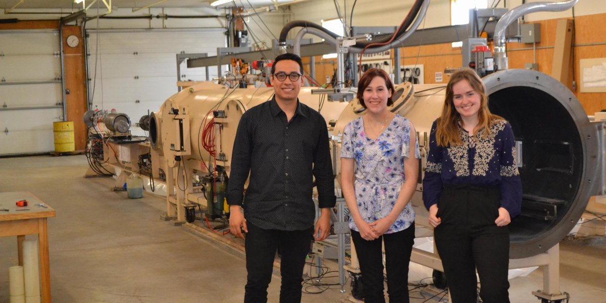 Happy to welcome our newest students to <a href="/Mach85Inc/">Mach85 Inc.</a> , (L-R) Luis Paredes (<a href="/myNBCC/">New Brunswick Community College</a>), Alyssa Wilcox (<a href="/UNBFCS/">UNB FCS</a>), and Sharon MacLean (<a href="/UNBEngineering/">UNB Engineering</a>). They are pictured here in front of a 2-Stage Light Gas Gun, which can shoot up to 8 km/s. Welcome to the team!