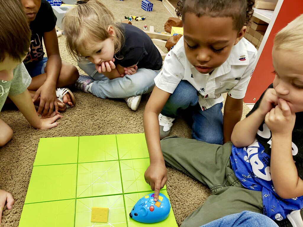 CarlenaSheeran's tweet image. Colby the Mouse 🐭 was a huge hit today with Jessica Pierce’s preschool students @NorthParkKids!  🙌🏼 They used the buttons to make the 🐭 find the cheese (coding). Critical thinking, partner work & happiness in one lesson! 💙 #HCSPreschool #HCSStrongerTogether #PreschoolCoding