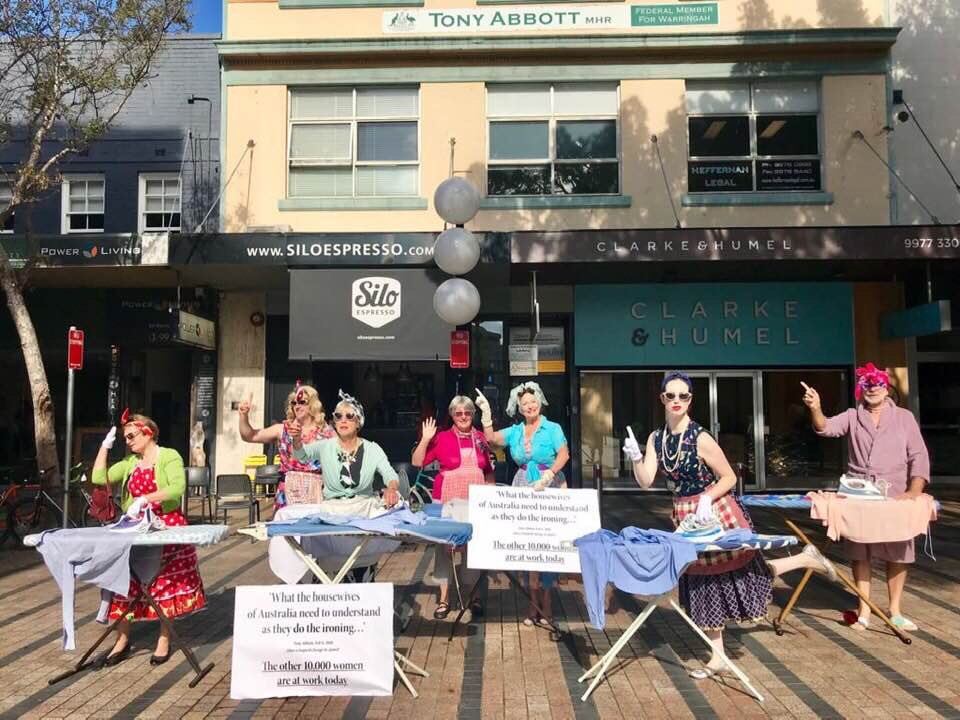 bairdjulia's tweet photo. “Housewives of Australia” gather to do their ironing outside ⁦@TonyAbbottMHR⁩’s office in Manly #auspol https://t.co/WaqLV8oMDu