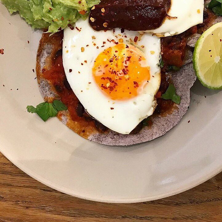 Sunny side up 😎 Organic free range fried eggs on blue corn tortilla. Get it on <a href="/deliveroo/">Deliveroo</a> &amp; <a href="/ubereats_uk/">Uber Eats UK</a> 🛵