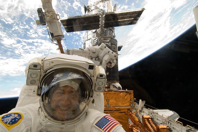 NASAHubble's tweet photo. #Now in 2009, astronauts Mike Massimino (@Astro_Mike) &amp; Mike Good begin the 4th spacewalk of Hubble's last servicing mission. Their main goal is to fix the Space Telescope Imaging Spectrograph, which suffered a power failure in 2004. #SM4live https://t.co/Ltqz7g5LQd https://t.co/JHQkFkHUyG