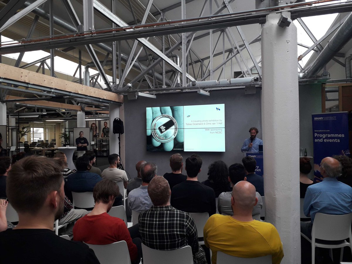 BinaryDistrict's tweet image. Here&apos;s @tobiasgroenland running us through some of the ethical hackers he has taken portraits of and their stories - a fascinating cast of characters including the likes of @UID_ #HHmeetup #HackersHandshake