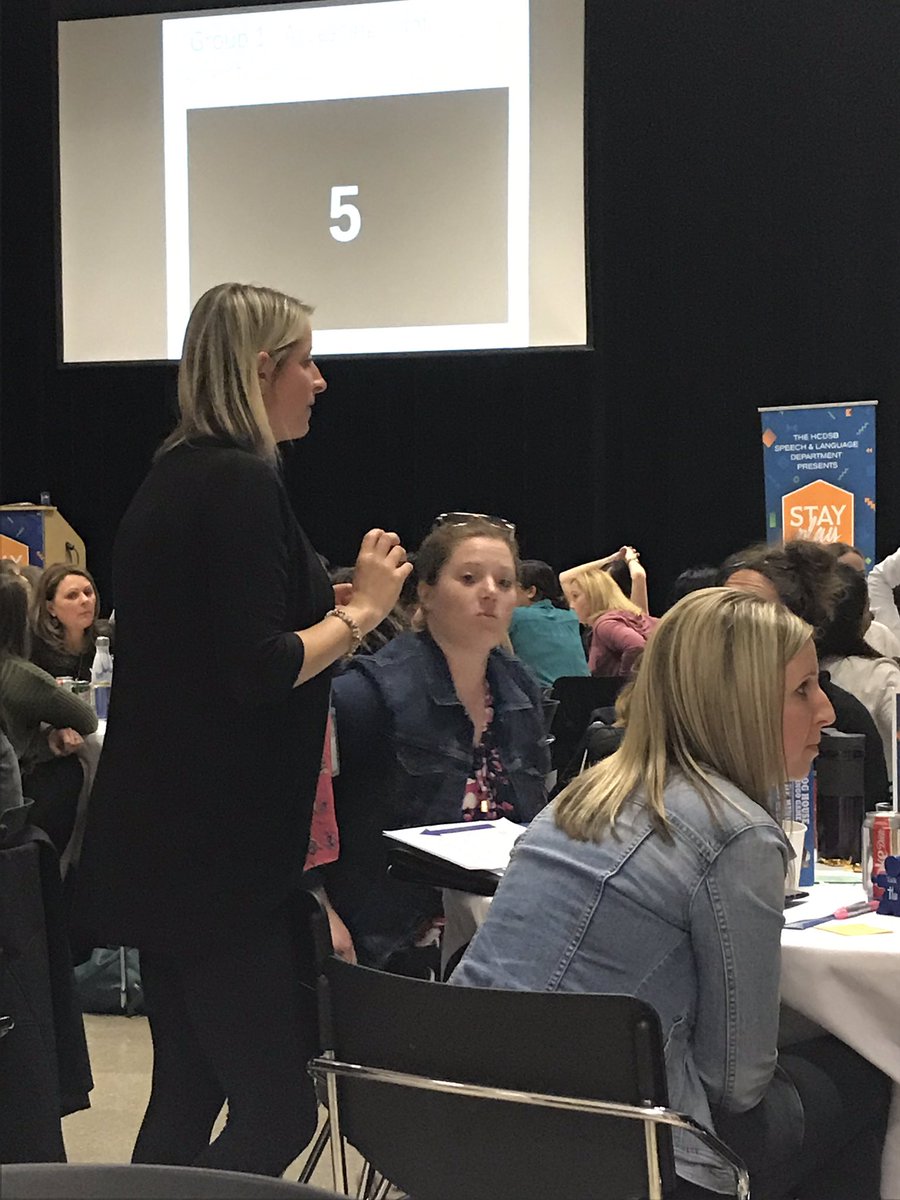 Educators, SLPs, and CDAs coaching our conference attendees on the skills needed to use Peer Mediated Prompting!