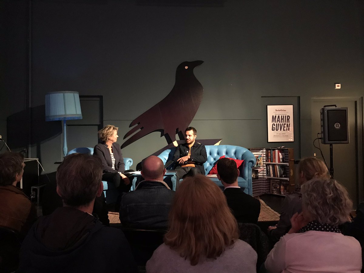 Mahir Guven and @margotdijkgraaf on stage talking about feeling like an exile and the influence of language.