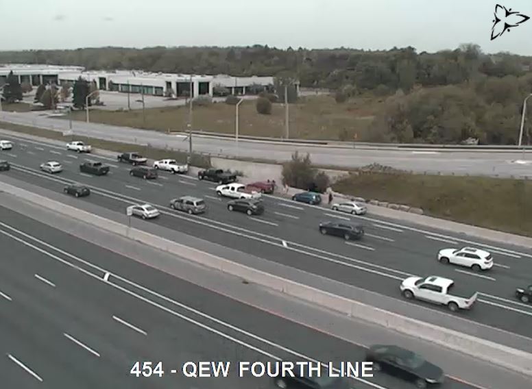 NewsRadioTO's tweet image. Several vehicles are blocking the right shoulder of the Westbound QEW, West of Dorval. Traffic is slow from approaching Trafalgar