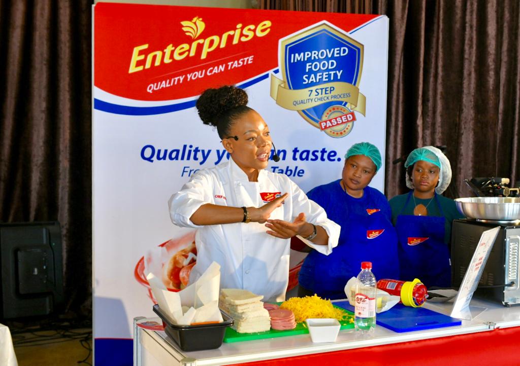 Team Polony learning the steps to a perfect French Polony and cheese garlic loaf, with <a href="/Chef_Nti/">Chef Nti</a>