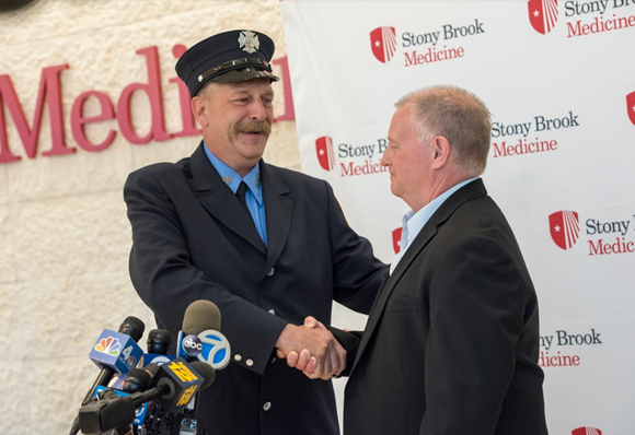 FDNY's tweet photo. Congratulations to #FDNY Firefighter Cliff Lesmeister #Engine262 who was awarded the “Heart Saver Community Award” by @StonyBrookMed for his role in saving a life while off duty. (Photo cred: Jeanne Neville) Read more: https://t.co/kOScx2SS7c https://t.co/FUDuhLmY1S