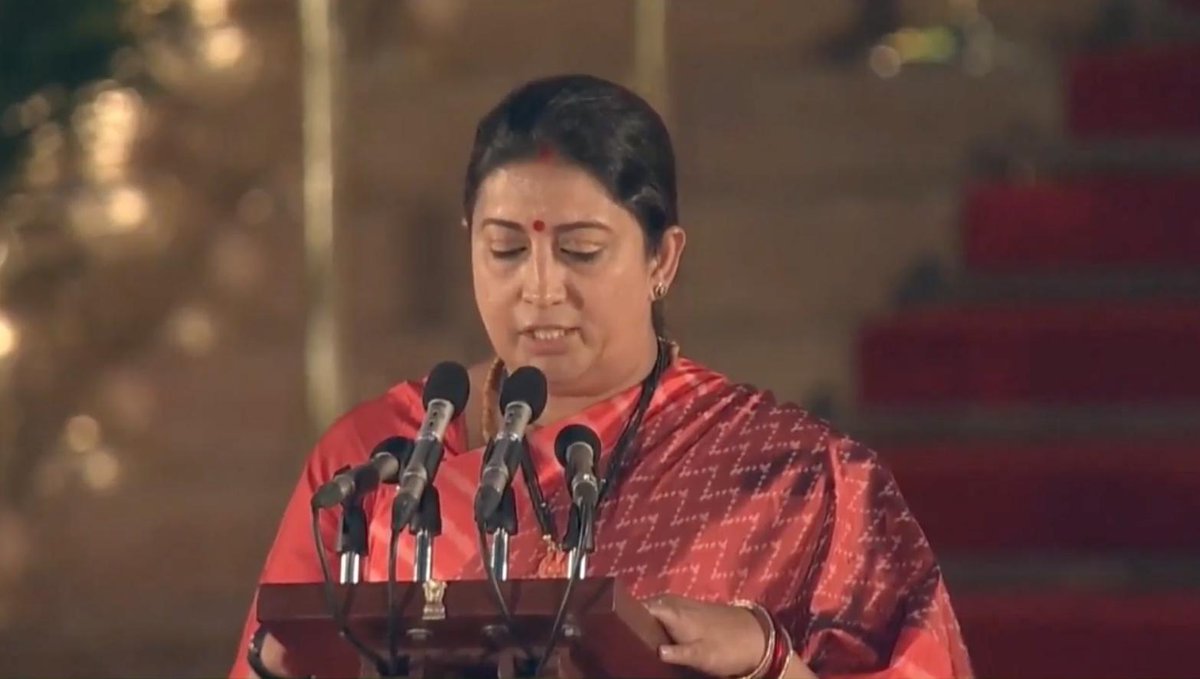BJP4India's tweet photo. Smt @smritiirani takes oath as Union Minister. #ModiSwearingIn https://t.co/NBoDH6Gj7t