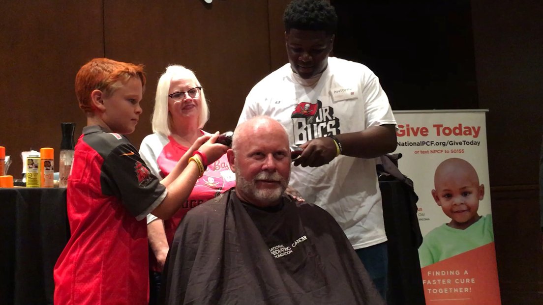 JennaLaineESPN's tweet photo. Bucs coach and cancer survivor @BruceArians gets his head shaved and painted by Josh Fisher, 10, and Dean Crenshaw, 5, as part of the Bucs' 7th Annual #CutforaCure benefiting @PediatricCancer. Both children have battled Acute... https://t.co/ApjiNZ7A0W https://t.co/gpgz4CJd8t