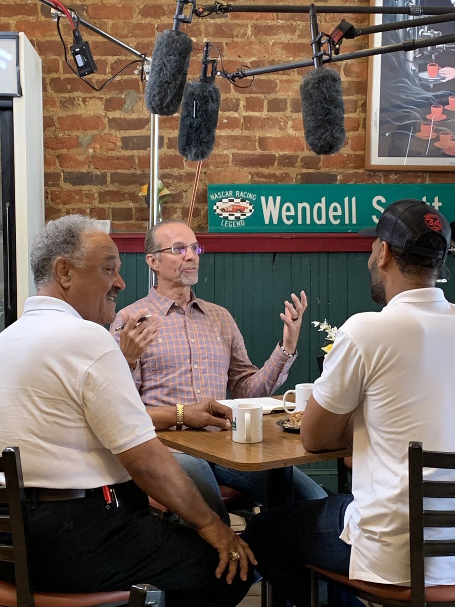 WendellScott_34's tweet photo. Frank and Warrick Scott exchange stories of NASCAR legend Wendell Scott with @kylepetty | Coffee with Kyle @NASCARonNBC @NBCSports in Danville, Virginia today! Check out the BTS 🎥 https://t.co/oSZPWD3xr4