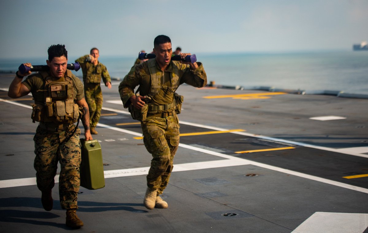 DefenceAust's tweet photo. Harder, Better, Faster, Stronger ๐โโ๏ธ๐๏ธโโ๏ธ๐ช
@USMC & Sailors with @MrfDarwin , along with @AustralianArmy Soldiers conduct joint physical & tactics training during #IPE19 aboard the HMAS Canberra. #POTD #FitnessFriday #AusArmy
๐ธ: @USMC LCpl. Nicholas Filca https://t.co/AQ2jCF8JL8
