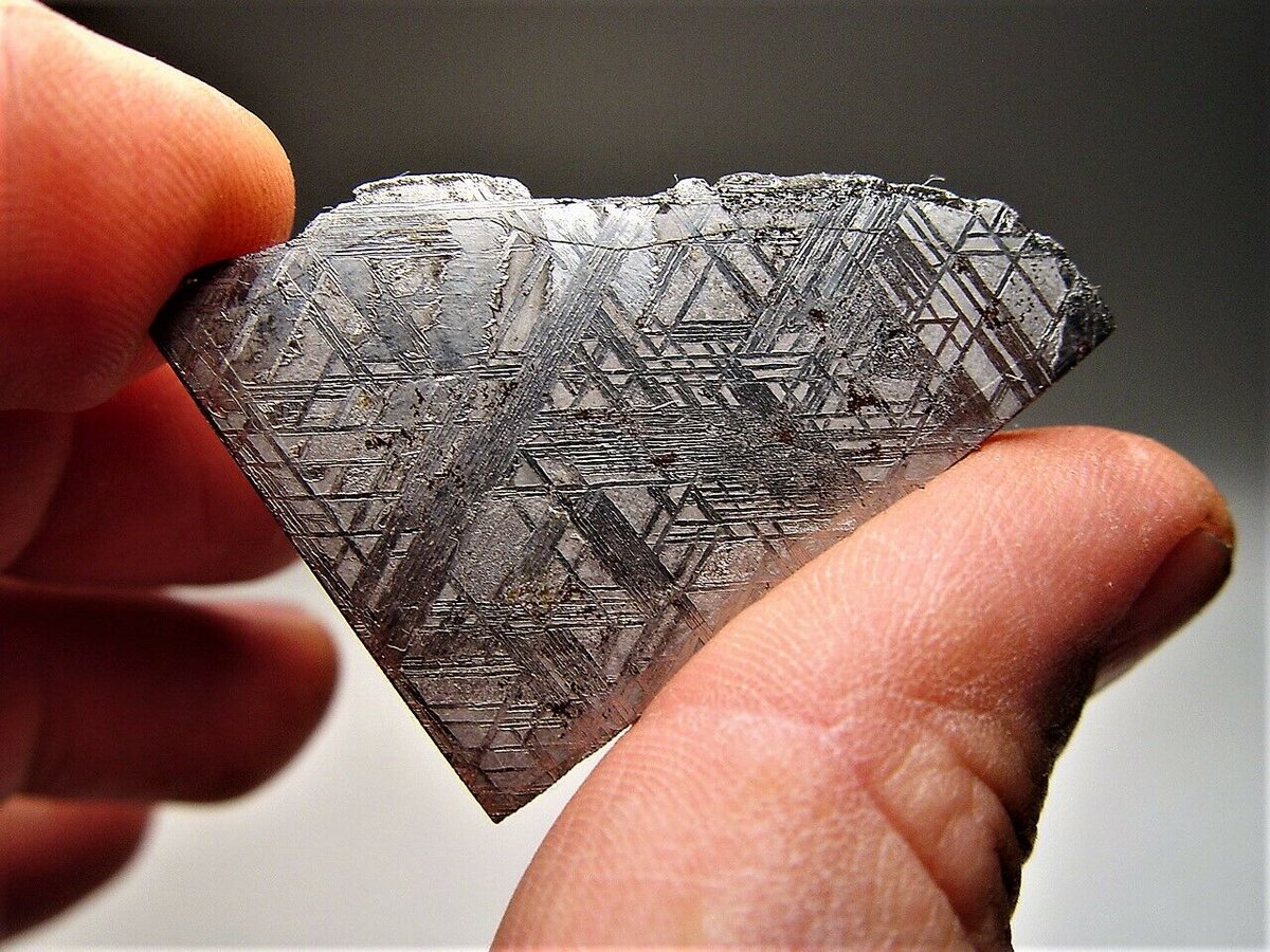 Please retweet -- I'm crafting this into a ring and you can watch me do it! Its a shard of a 450 million yr old #Meteorite that hit over 1 million yrs ago in North Scandinavia. Once the molten core of a distant planet...