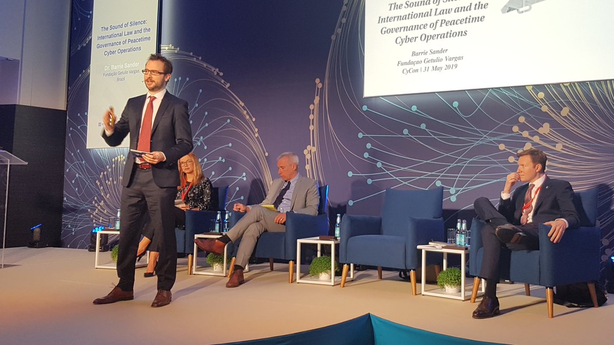 KuboMacak's tweet photo. Dr @Barrie_Sander presents his research into the reasons behind the general State silence about the applicability of international law to cyber operations #CyCon2019 @ccdcoe https://t.co/fpk8KtPQiU