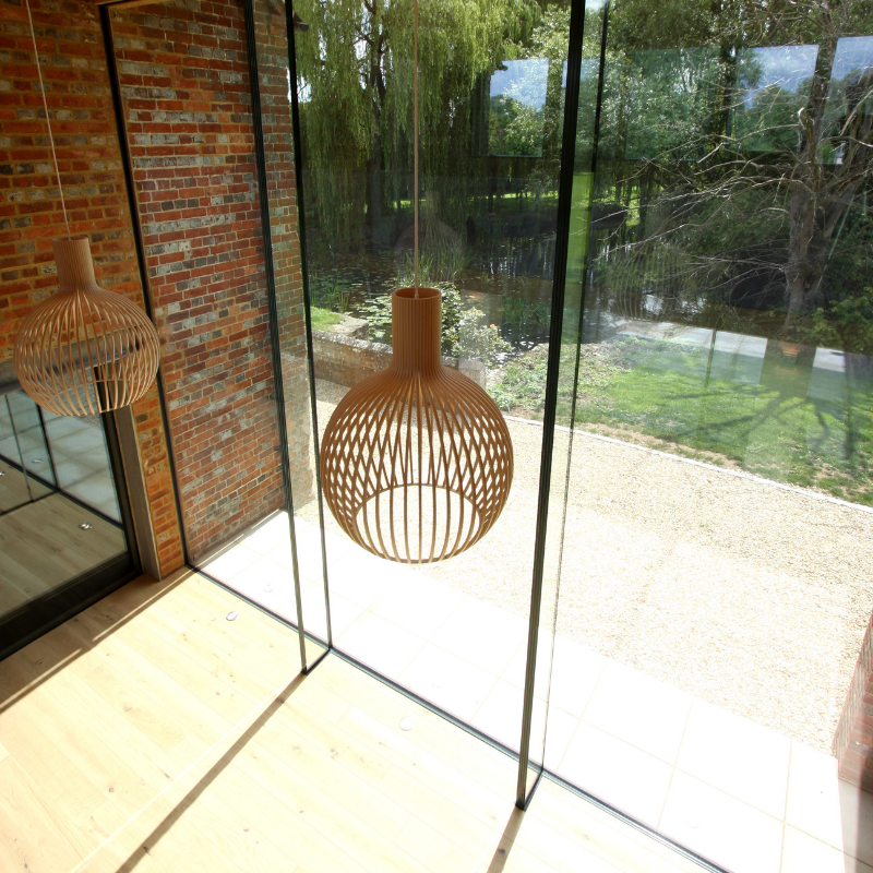 IQGlassUK's tweet photo. This contemporary design features a two-storey #glasslink with double height frameless #structuralglazing on both sides, linking the existing house and old mill building together >https://t.co/ulc3aI80B9 https://t.co/cKEWWyB42j