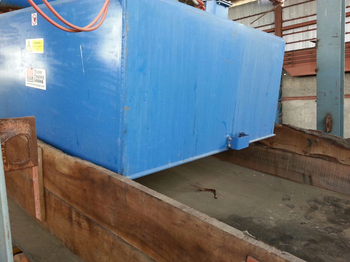 Large Oil Cooled Electro Magnet suspended over a conveyor transporting #sugar beet. The #magnet removes any large tramp metal before the beet enters the main processing plant #foodprocessing | mastermagnets.com/product/electr…