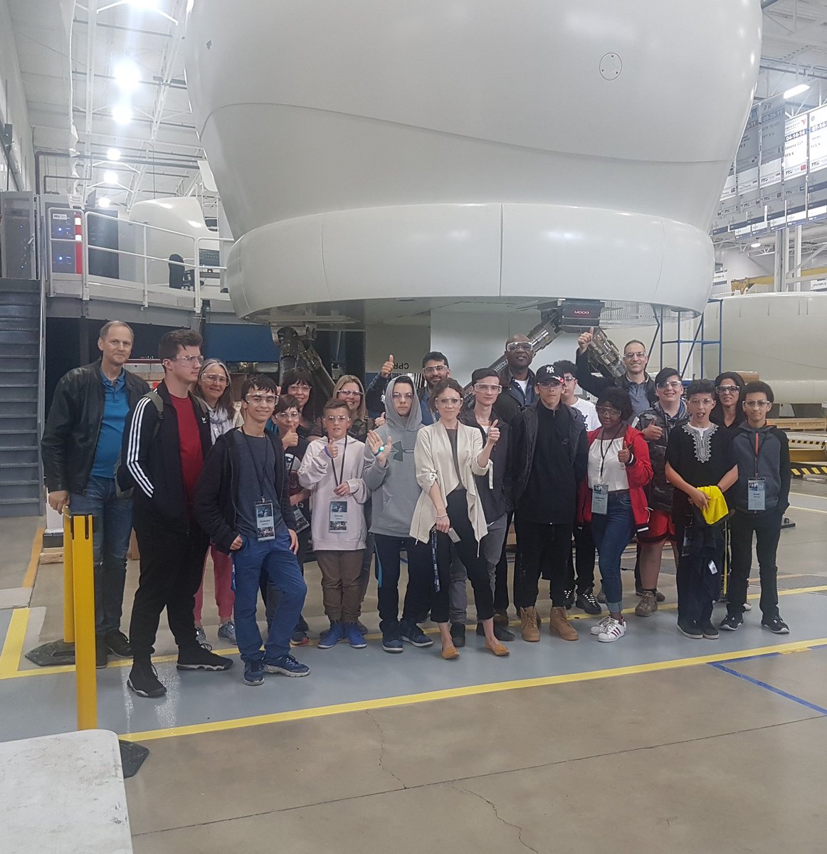 TRUsimulation's tweet photo. What a great group we welcomed to our Montreal facility yesterday to learn first-hand about the inspiring world of flight simulation! ✈️ #TRUsim is a proud community friend and supporter of @trioomph1! https://t.co/2A8xVHDJii