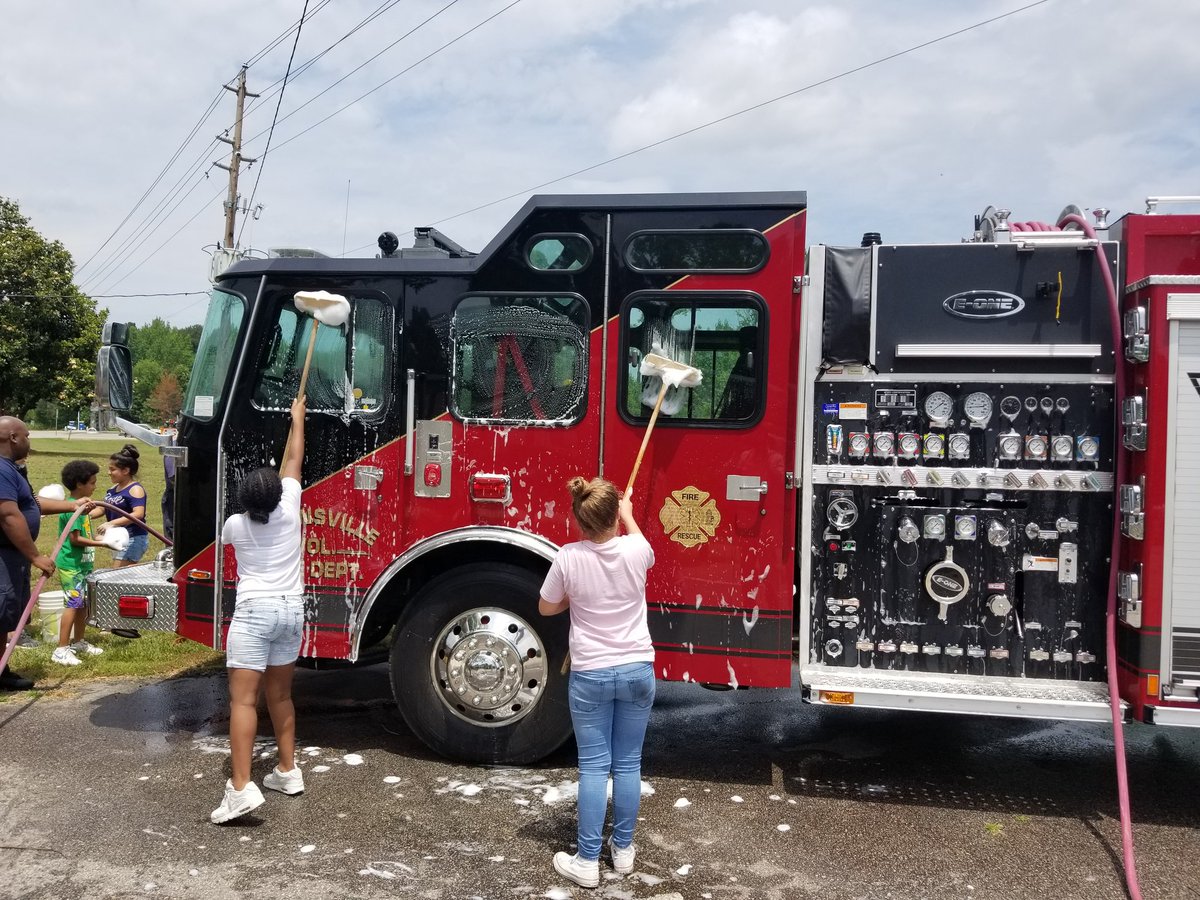 Lakaiyah and Carmen don't waste any time washing the truck.