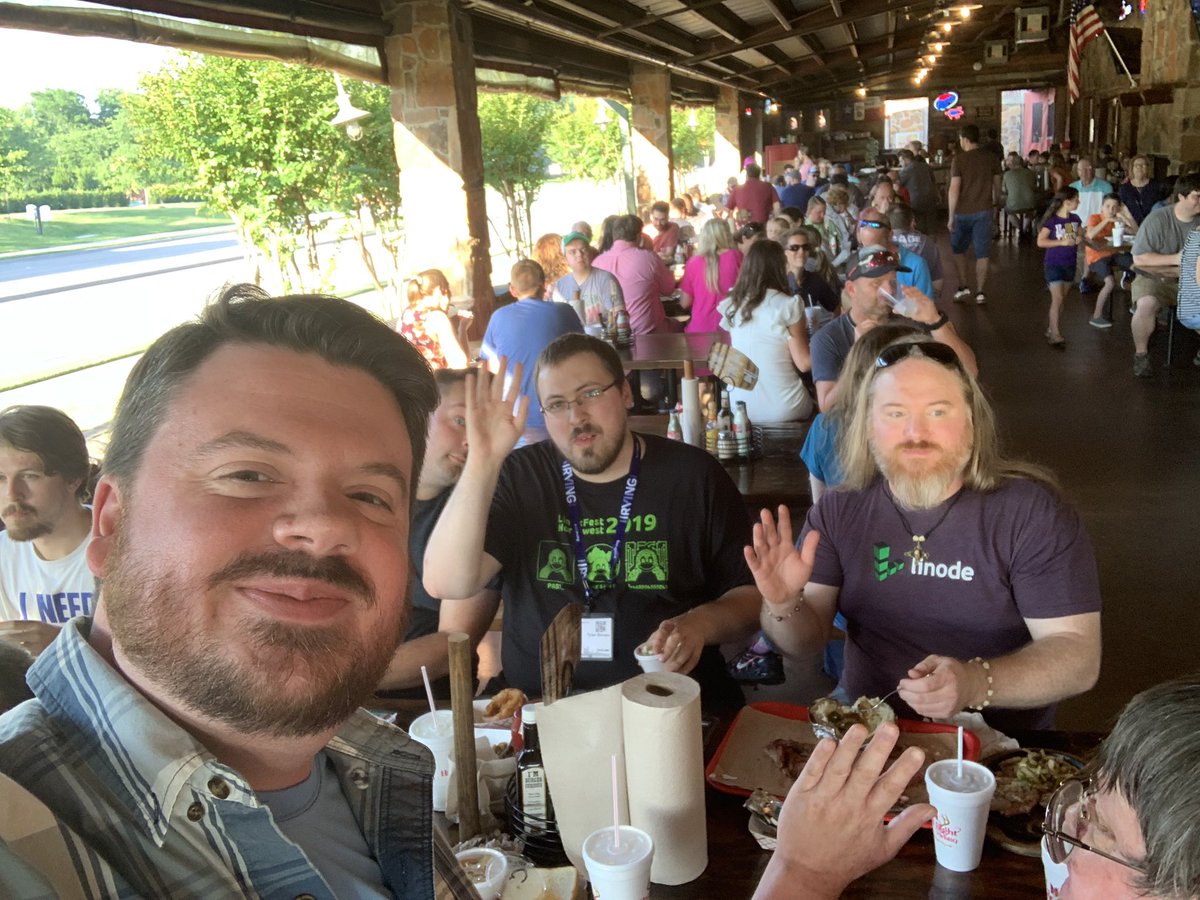 ChrisLAS's tweet photo. So we kinda took over the place! About five tables enjoying some BBQ with @linuxacademyCOM students and @jupitersignal audience while listening to some #bluegrass https://t.co/IXqlmhzKEU