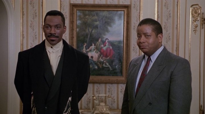 Eddie Murphy plays Marcus Graham, a womanizing Advertising Executive. Layering is the watchword for him as he pairs his suits with stylish coats and complimentary scarves. Even his haircut inspired a legion of playboys who followed suit.