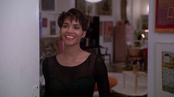 The sweet-natured Angela Lewis (played by a then relatively unknown Halle Berry) has a comforting and charming sense of style. Her favorite accessory is her winning smile. It's interesting to see Halle before she became one of Hollywood's biggest bombshells of all-time.