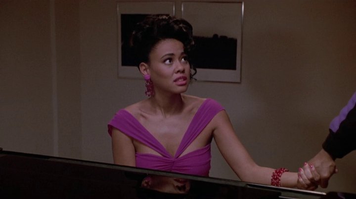 Despite playing a minor character, Lela rocks one of my favorite outfits in the entire movie. She looked gorgeous in this pink cocktail dress.