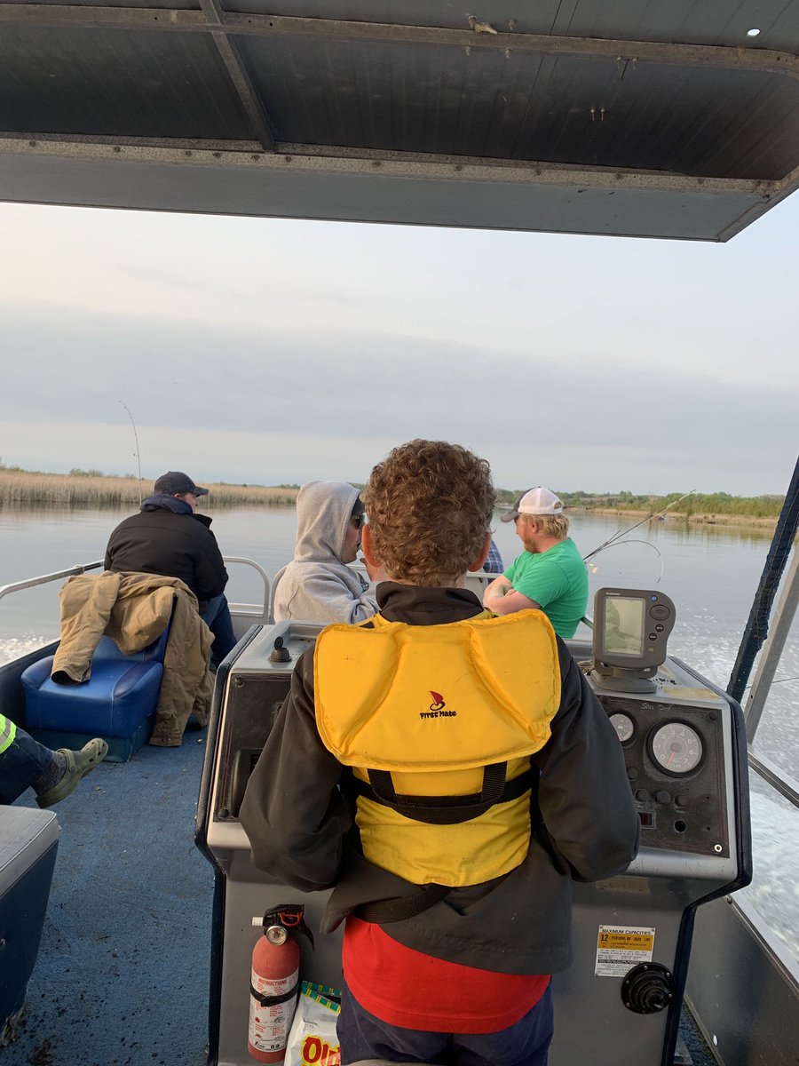 Really happy boy catching his first pickerel 15” on the annual fishing trip in Lindsay and a good boat driver too