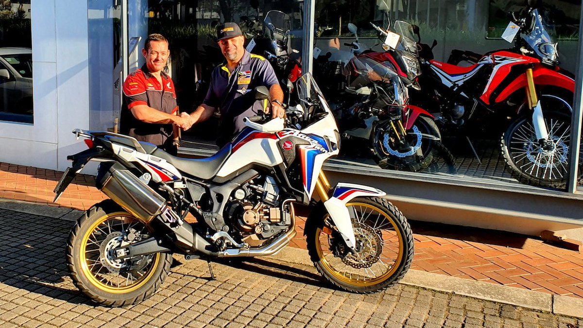 BikeTalkSA's tweet photo. SPONSORED - Back on a Honda and loving it. Seen here is Roy Hallett of @HUmhlanga on behalf of @HondaSA handing over the Africa Twin DCT to Hein Jonker. Thank you, Riaan Fourie for making this happen!
#honda #motorcycle #africatwin https://t.co/2E0nscOqhF