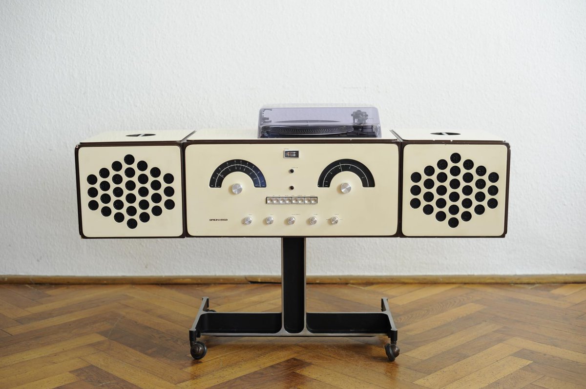 krystalxart's tweet photo. krystal is using a mid-century modern brionvega turntable that was manufactured in the 60s by pier giamcomo and achille castiglioni. the shape of the record player can be stacked or removed to create various shapes. david bowie's own custom brionvega sold for £257k in 2016. https://t.co/kmIaNONYhy