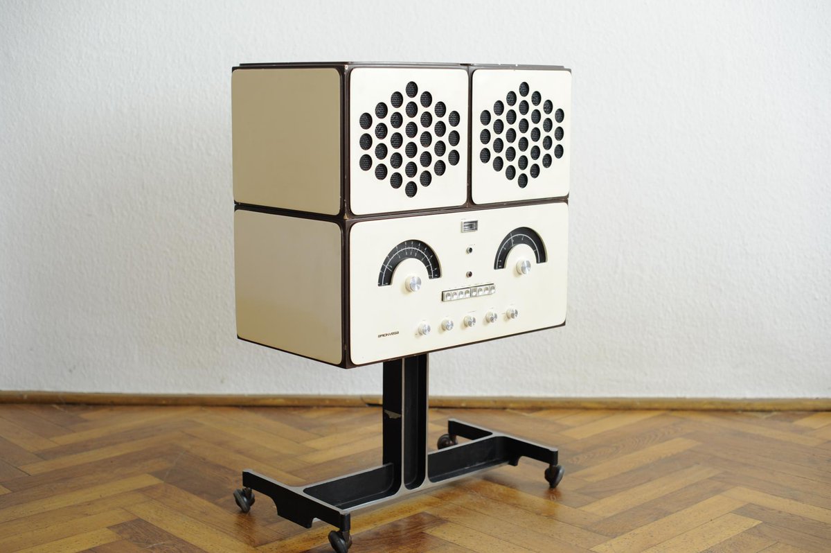 krystalxart's tweet photo. krystal is using a mid-century modern brionvega turntable that was manufactured in the 60s by pier giamcomo and achille castiglioni. the shape of the record player can be stacked or removed to create various shapes. david bowie's own custom brionvega sold for £257k in 2016. https://t.co/kmIaNONYhy